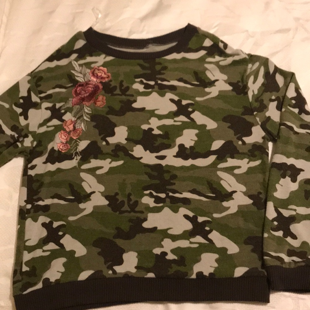 Camouflage knit shirt. Size is M new but no tags.